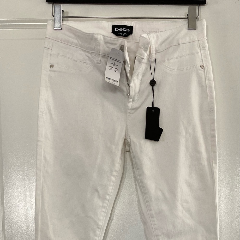 White fashion jeans by bebe. Stretch